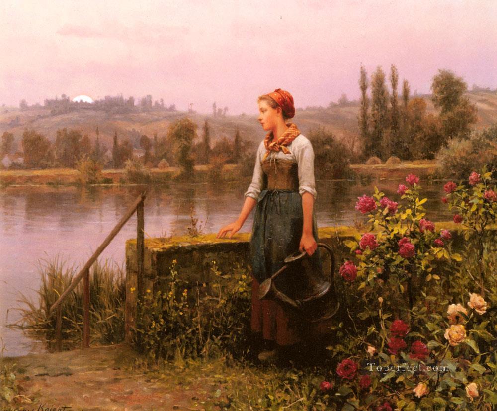 Una mujer con una regadera junto al río, paisana Daniel Ridgway Knight Pintura al óleo